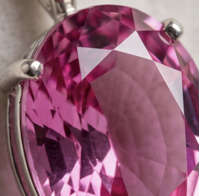 Incredible oval cut 30.8 carat Bubblegum Pink Sapphire .925 Sterling Silver handcrafted pendant - Close-up of 30.8 carat oval cut Bubblegum Pink Sapphire in setting.