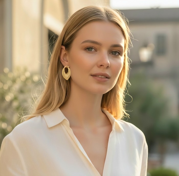 Black Label Collection - Dubai Style - Natural 22K Gold over .925 Sterling Silver handmade earrings - Woman wearing gold earrings from Black Label Collection, front view.