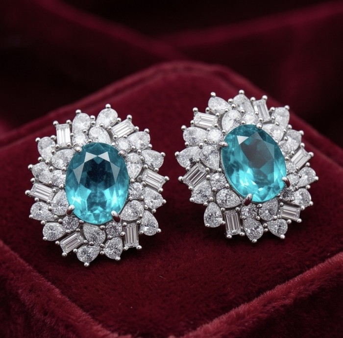 Royalty oval cut 5.2 carat Paraiba Tourmaline .925 Sterling Silver entirely handmade earrings - Close-up of Paraiba Tourmaline earrings on velvet background