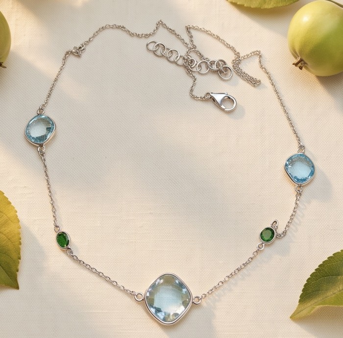 Infinity 11.5 carat Authentic Multigems Rhodium over .925 Sterling Silver handcrafted Statement necklace - Infinity multigem necklace display on fabric background.