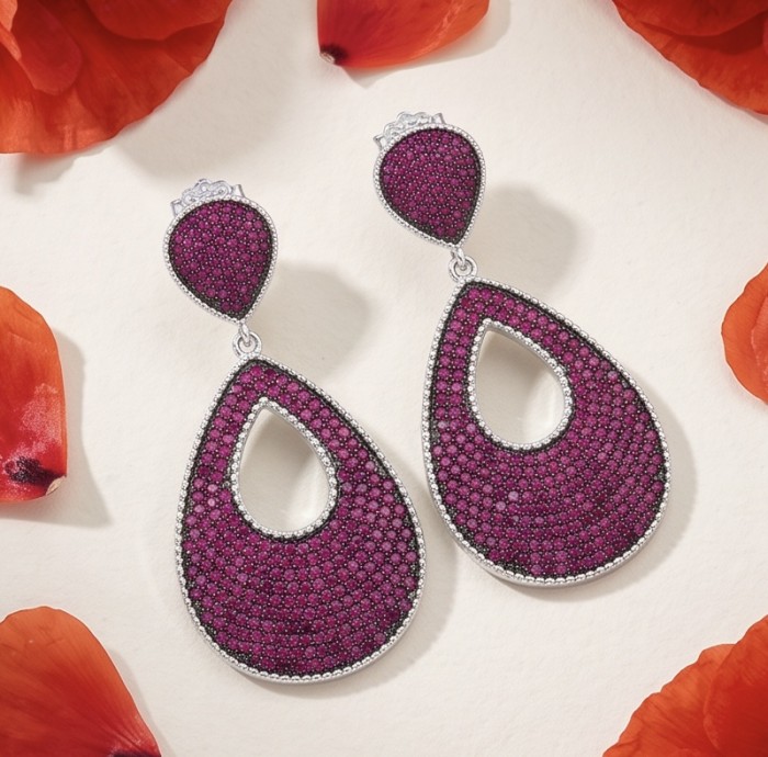 Bella Rossa - 2.5 carat pave Mozambique Ruby .925 Sterling Silver dipped in Rhodium handcrafted earrings - Teardrop ruby earrings overhead view with red petals