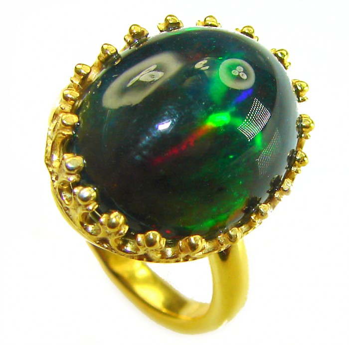A COSMIC POWER Genuine 15.2 carat Black Opal 18K Gold over .925 Sterling Silver handmade Ring size 7 - Black opal ring in 18K gold, close-up of stone and setting.