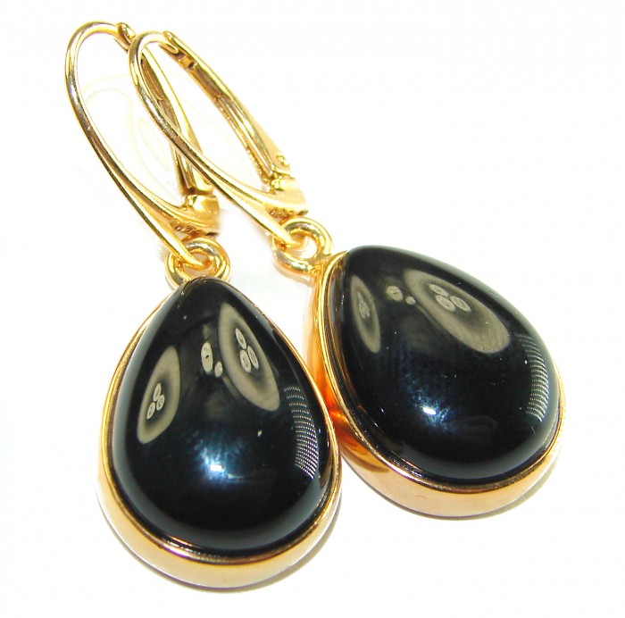 Outstanding authentic Onyx 14K Gold over .925 Sterling Silver Earrings - Close-up of onyx teardrop earrings with gold and silver setting