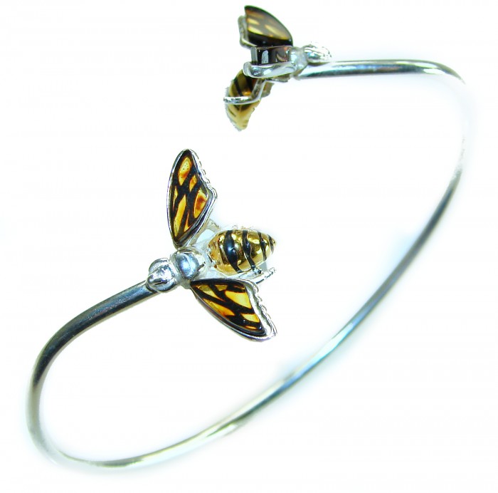 Golden Bees Genuine Baltic Amber .925 Sterling Silver handamde Bracelet - Silver bracelet with golden bee designs, side angle view.