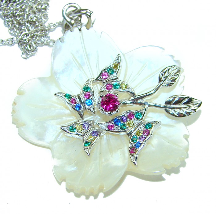 Precious White Flowers Blister Pearl .925 Sterling Silver Necklace - Close-up of flower-shaped pendant with colorful gems on pearl background.