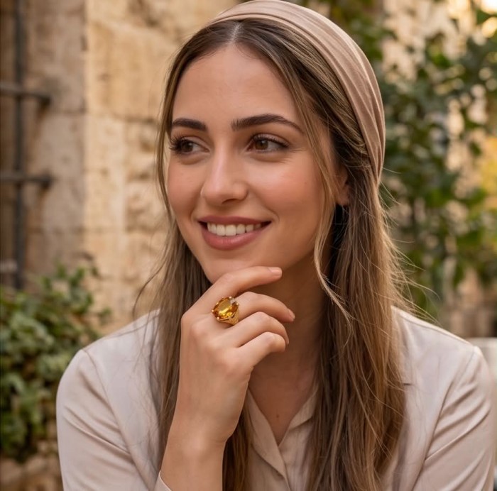 Liliana 24.5 carat Champagne Smoky Topaz .925 Sterling Silver dipped in real 18K Gold Oversized Ring size 10 - Woman wearing Liliana 24.5ct Champagne Smoky Topaz ring on hand.