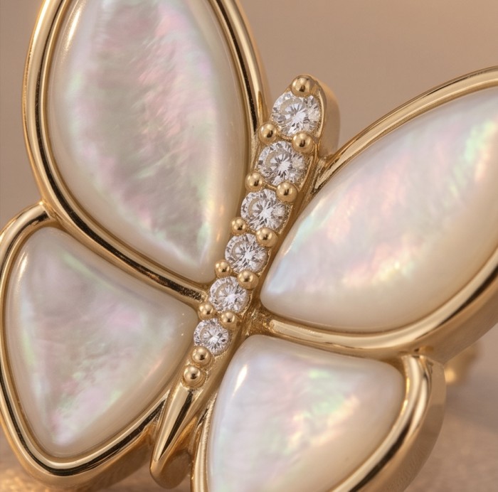 Two Butterflies Genuine Blister Pearl 14K Gold over .925 Sterling Silver handcrafted Statement Earrings - Close-up of butterfly jewelry, pearl wings and diamond accents in gold.