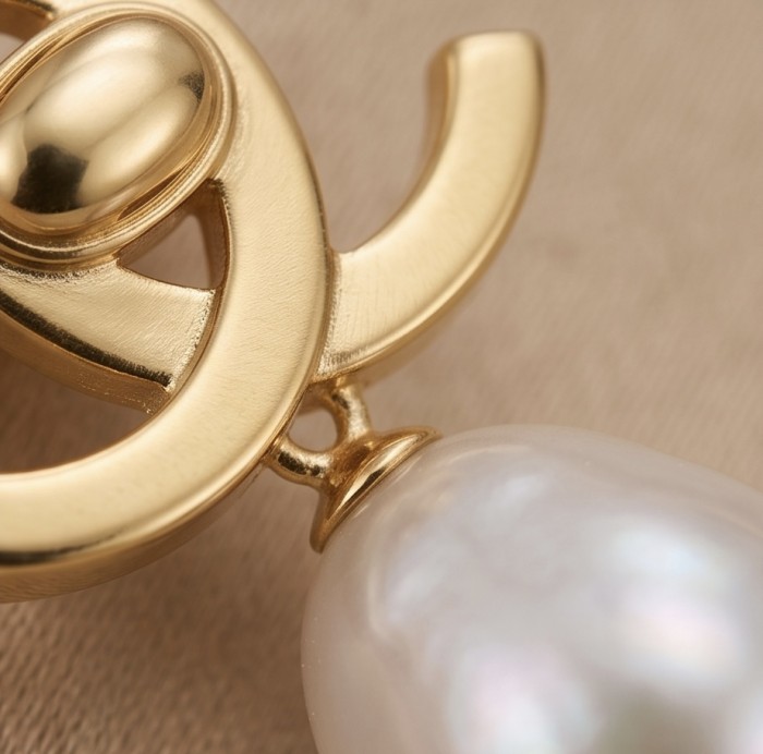 Classy Design - Genuine Pearl 14K Gold over .925 Sterling Silver handcrafted Statement Earrings - Close-up of gold clasp and pearl detail on Classy Design jewelry.