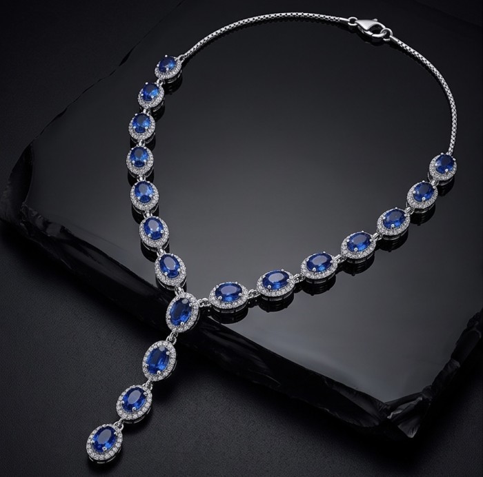 Luxurious 9.2 carat Genuine Tanzanite .925 Sterling Silver handmade Necklace - Luxurious 9.2 carat tanzanite necklace, front view, on black surface.