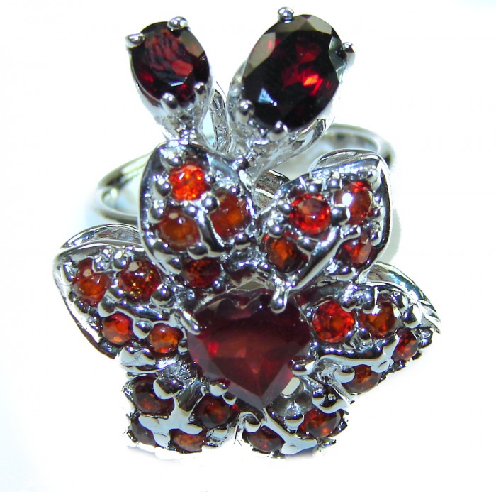 Red Flower Authentic 19.5 carat faceted authentic Australian Garnet .925 Sterling Silver handcrafted ring; s. 6 - Red floral ring with red stones, top view, detailed design.