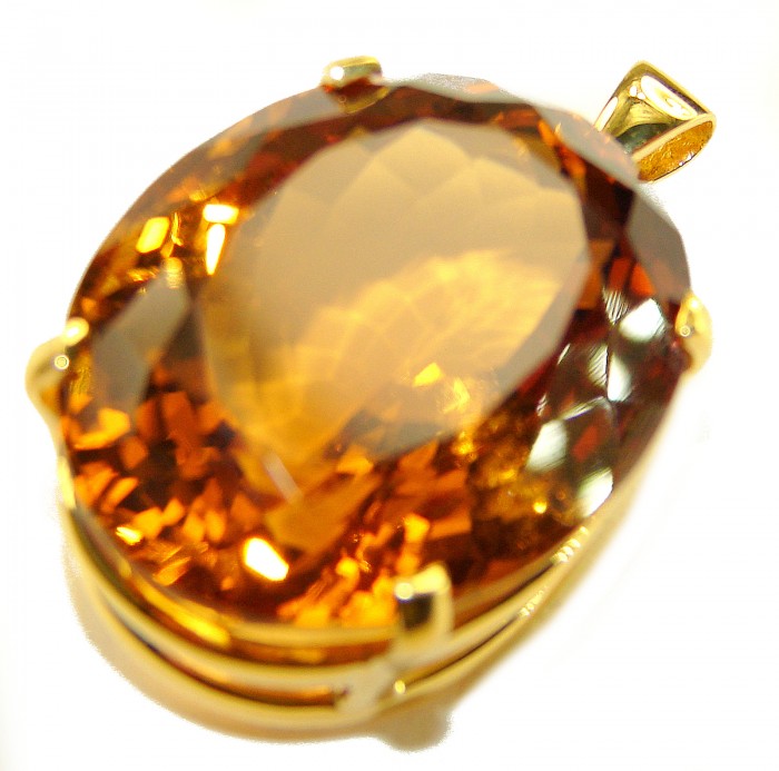 Luxury genuine 39.7 CARAT oval cut Champagne Topaz .925 Sterling Silver dipped in 22K Gold handmade Pendant - Close-up of 39.7 carat oval cut Champagne Topaz pendant in gold setting.