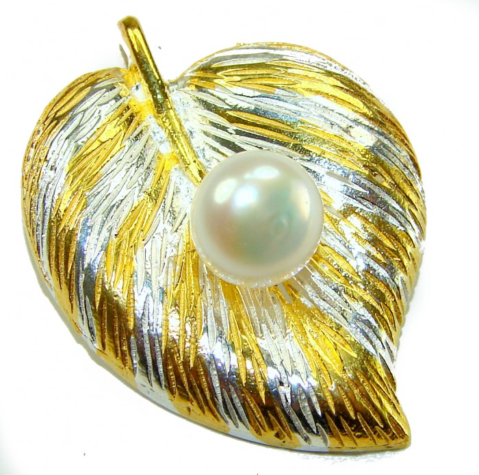 Genuine Pearl 14K Gold .925 Sterling Silver handmade Pendant - Leaf-shaped pendant with pearl, gold, and silver, top view.