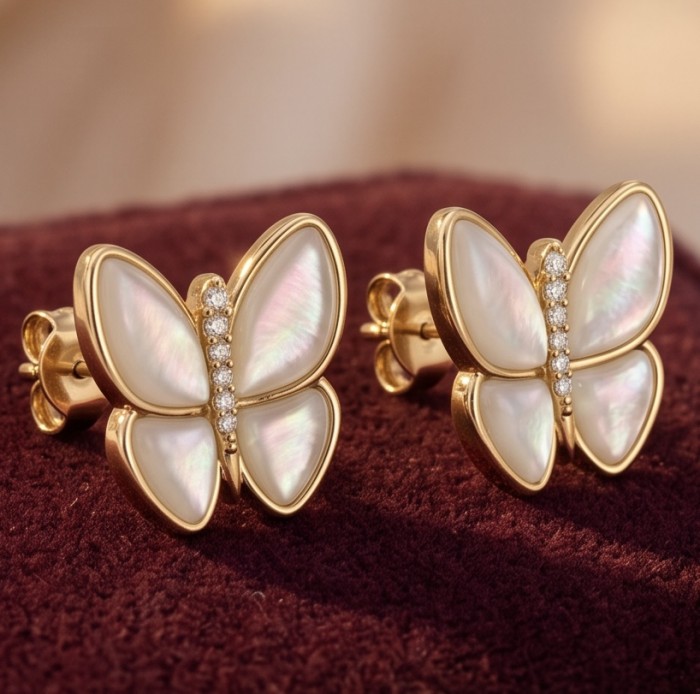 Two Butterflies Genuine Blister Pearl 14K Gold over .925 Sterling Silver handcrafted Statement Earrings - Close-up of butterfly earrings with pearls and gold accents