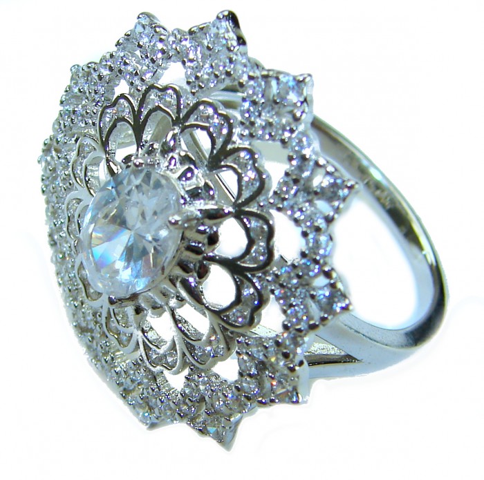 New Concept 14.5 carat White Topaz .925 Sterling Silver ring size 7 - Close-up of ornate white topaz and silver ring from a side angle.