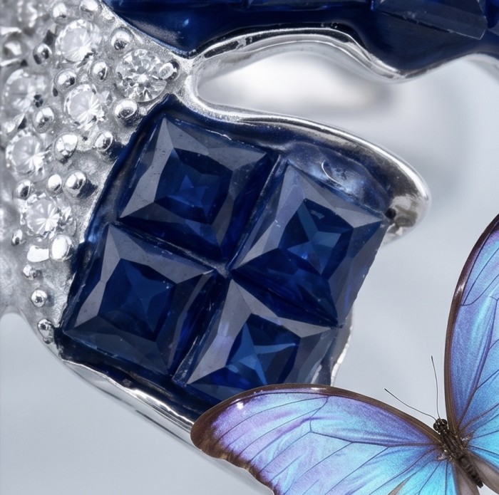 Blue Butterfly Authentic mystery setting 10.2 carat Sapphire .925 Sterling Silver handcrafted Ring size 7 - Close-up of sapphire and diamond detail with butterfly motif.