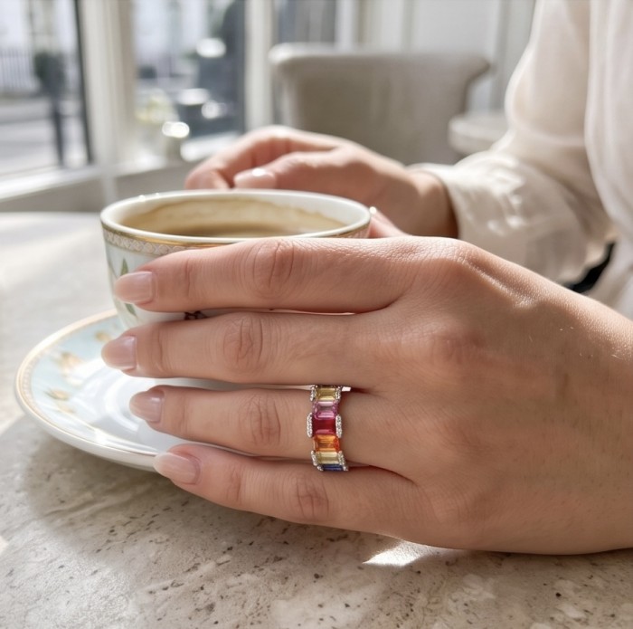My own Rainbow - authentic 8.7 carat Topaz .925 Sterling Silver Ring size 7 - Ring with rainbow topaz worn on hand while holding a coffee cup.