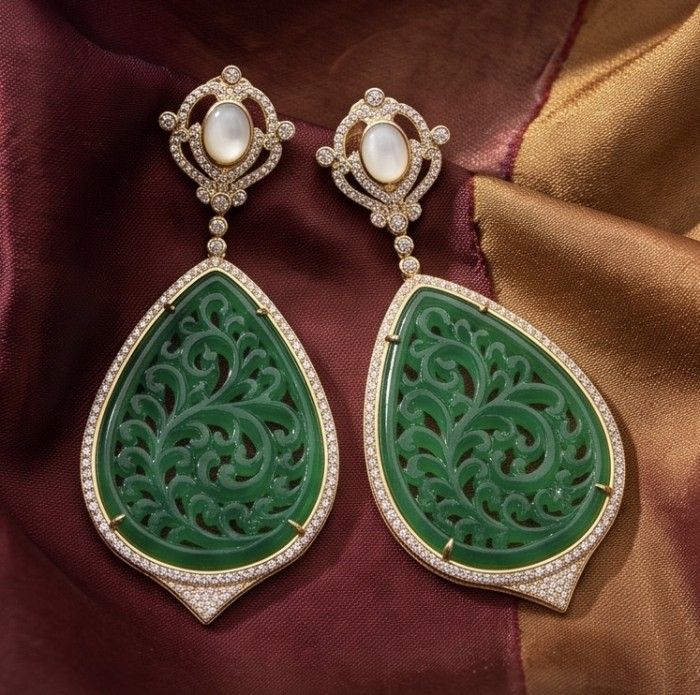 Enchanted Beauty 10.5 carat authentic Jade 14K Gold over .925 Sterling Silver handcrafted Long Statement earrings - Enchanted Beauty jade earrings front view on colorful fabric background.