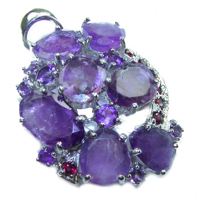 Beautiful Purple Treasure 22.5 carat Amethyst .925 Sterling Silver handcrafted Pendant - Purple amethyst pendant close-up, showcasing multiple stones and silver setting.