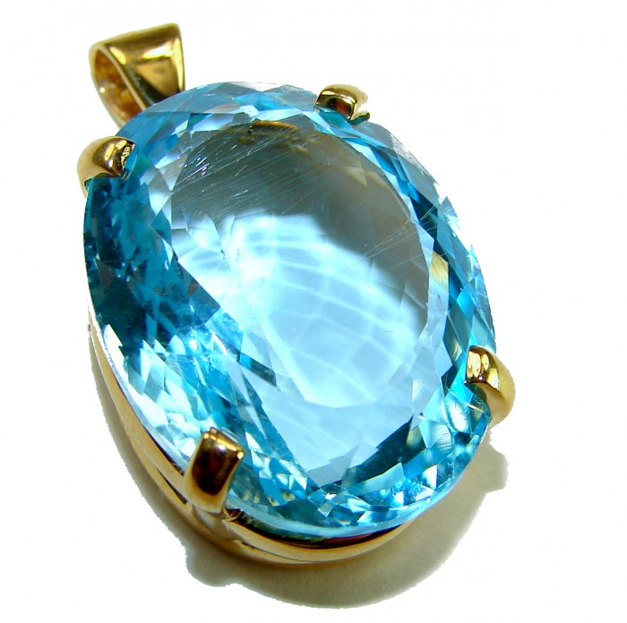 Atlantica oval cut 29.8 carat Swiss Blue Topaz 18K Gold over .925 Sterling Silver Handcrafted Pendant - Close-up of oval 29.8 carat Swiss Blue Topaz in 18K gold setting.