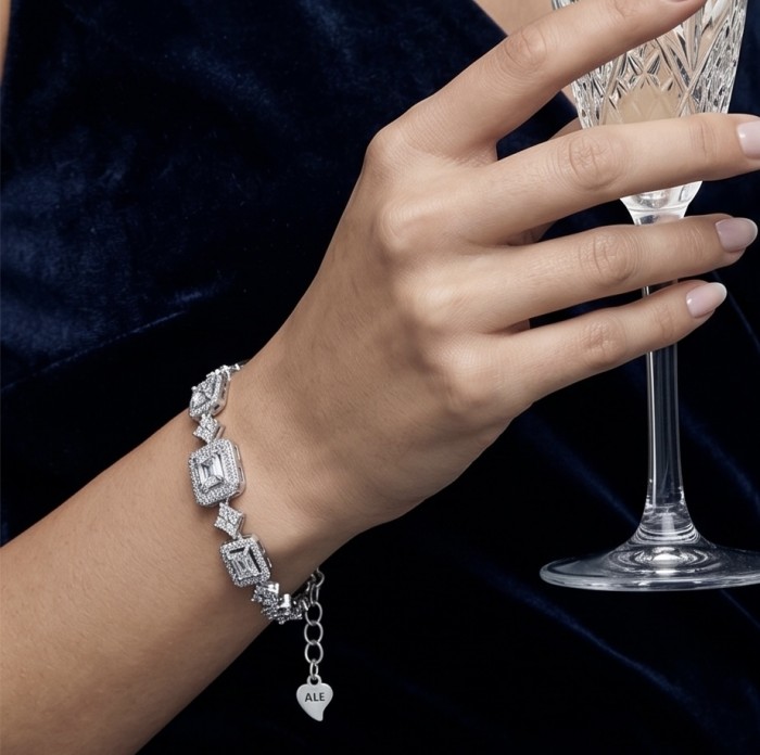Carolyn - Precious 15.7 carta White Topaz rhodium over .925 Sterling Silver .925 Sterling Silver Statement Bracelet - Bracelet on wrist, holding glass; Carolyn - Precious 15.7 carta White Topaz