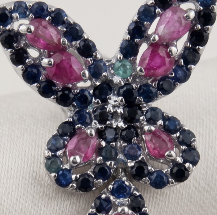 RARE BEAUTY! Valentina 28.2 carat Ruby Emerald Sapphire .925 Sterling Silver dipped in rhodium Statement handcrafted earrings - Close-up of butterfly-shaped ruby, emerald, and sapphire jewelry.