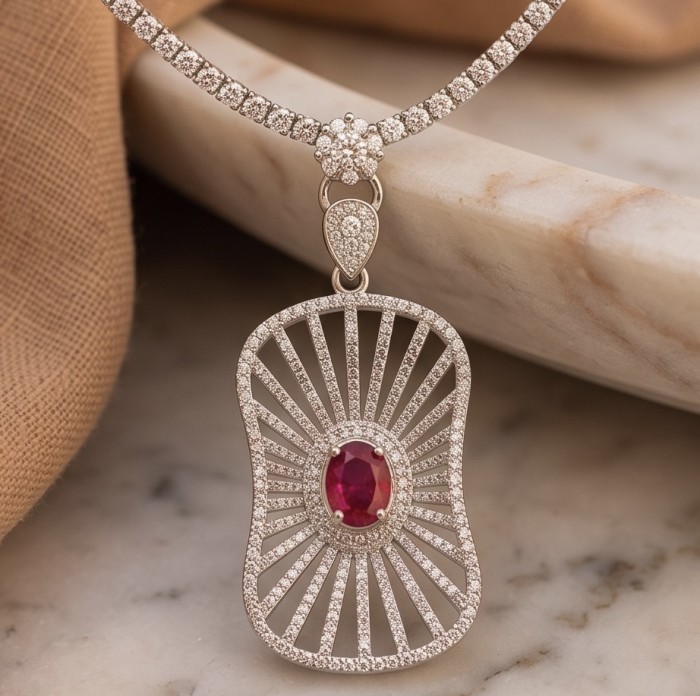 Luxurious 4.8 carat natural Mozambique Ruby .925 Sterling Silver dipped in rhodium Statement Necklace - Close-up of luxurious ruby pendant in sterling silver setting
