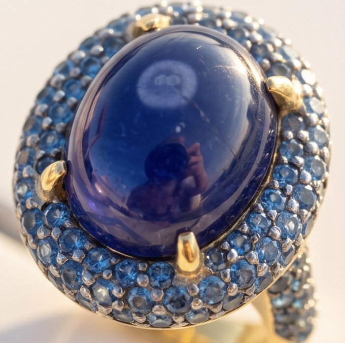 The Star of Kilimanjaro oval cut 22.6 carat Tanzanite 22K Gold over .925 Sterling Silver handmade Statement ring size 7 - Close-up of The Star of Kashmir sapphire ring with blue gemstones