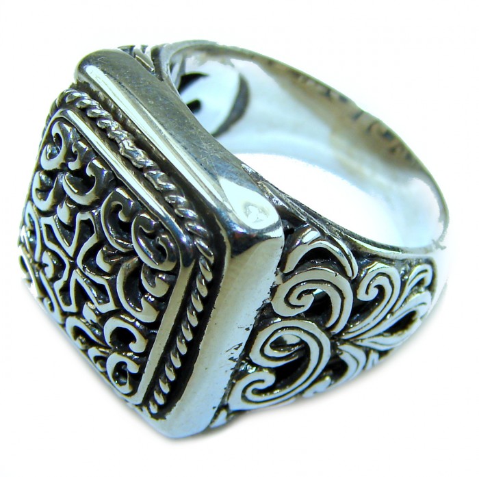 Large and Solid Bali made .925 Sterling Silver ring size 8 - Ornate sterling silver ring with intricate designs, side view.