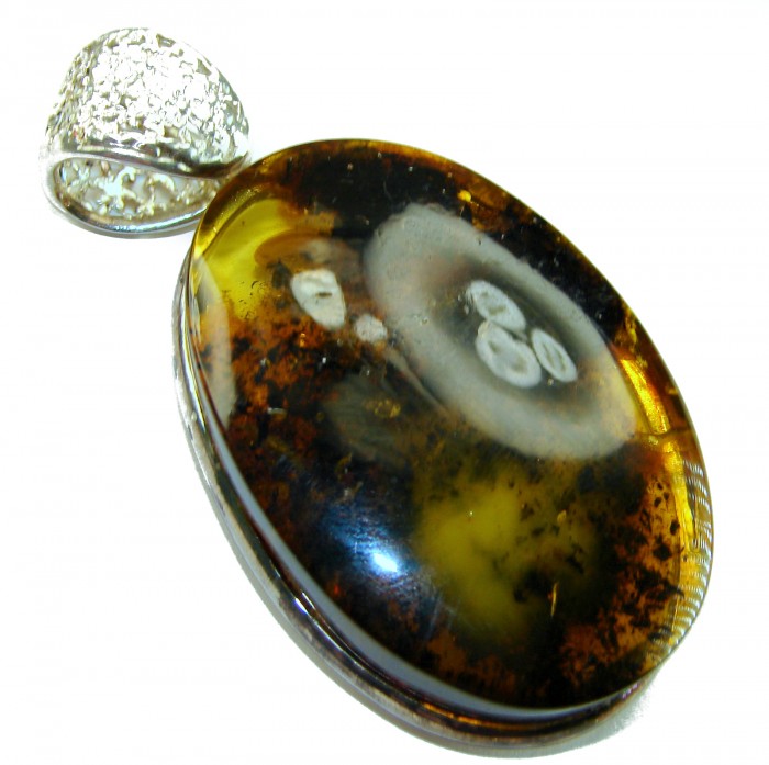 Prehistoric cognac Authentic Baltic Amber .925 Sterling Silver beautifully handcrafted Pendant - Close-up of Baltic amber pendant with sterling silver bail.
