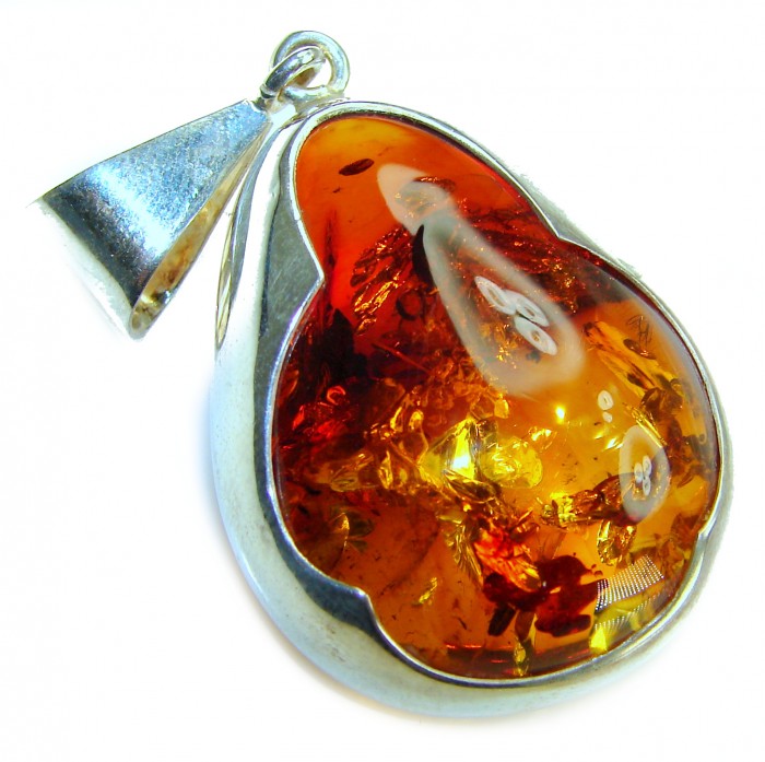 Prehistoric Authentic Baltic Amber .925 Sterling Silver beautifully handcrafted Pendant - Close-up of Baltic amber and sterling silver pendant.