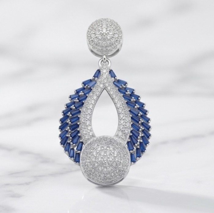 Heirloom Genuine 8.5 carat Sapphire .925 Sterling Silver dipped in rhodium handmade Pendant - Sapphire and silver earring, front view on marble background.