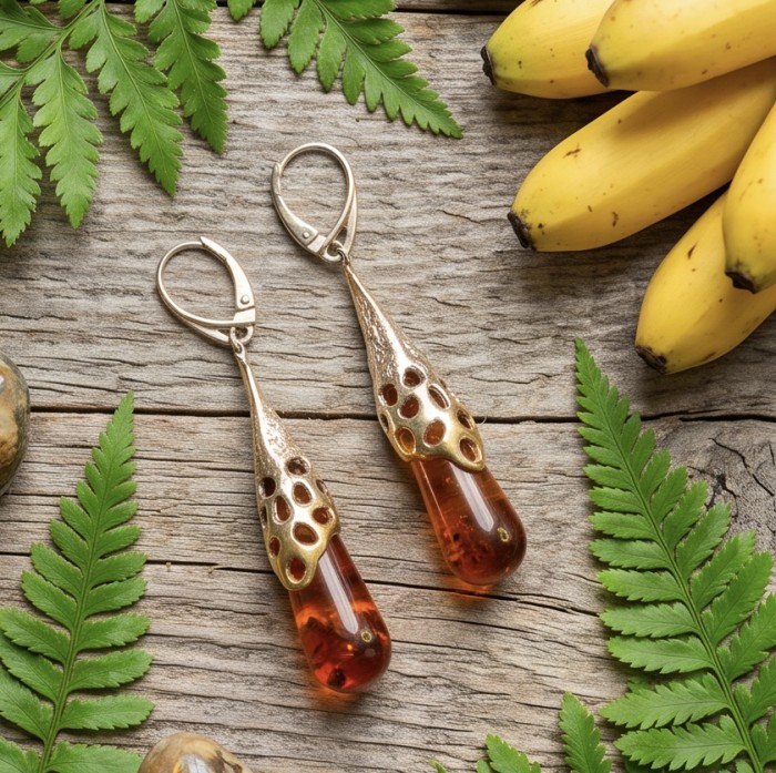 Very Special product - Wonderful natural Baltic Amber 2 tones .925 Sterling Silver entirely handcrafted earrings - Amber drop earrings with bronze detail, flat lay on rustic wood and greenery.