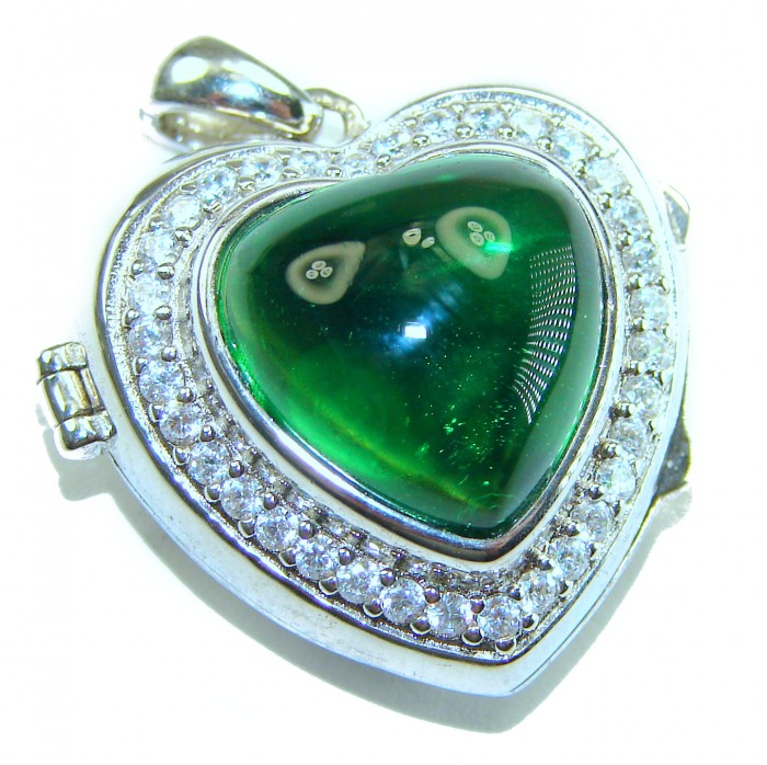 Secret compartment Authentic 18.5 carat Green Helenite .925 Sterling Silver Pendant - Heart-shaped pendant with green Helenite and diamonds, close-up view.