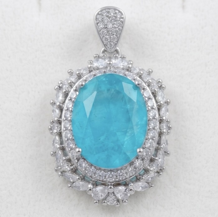 Wonderland 12.8 carat classic oval cut Paraiba Tourmaline Moissanite .925 Sterling Silver Handcrafted Statement necklace - Close-up of Wonderland 12.8 carat oval Paraiba Tourmaline pendant.