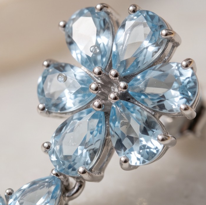 Serenity 14.5 carat genuine Swiss Blue Topaz .925 Sterling Silver handmade Statement Handcrafted earrings - Close-up of Swiss Blue Topaz flower design in Sterling Silver.