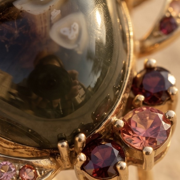 Rare finding! 24.4 carat authentic Kashmir Star Sapphire 22K Gold over .925 Sterling Silver handmade Statement Pendant - Close-up of Kashmir Star Ruby with surrounding gemstones in 22K gold setting.
