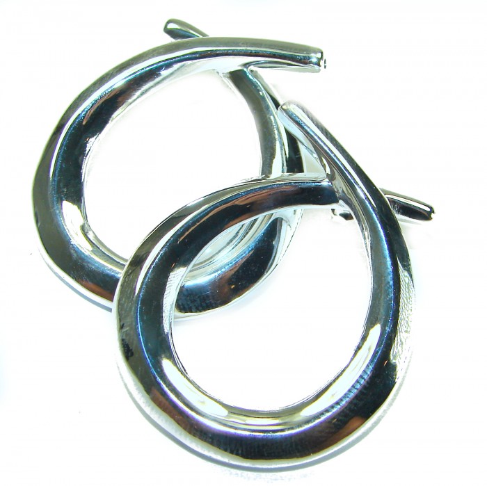 Large 1 5/8 inches long highly polished .925 Sterling Silver Italy made Earrings - Close-up of large polished sterling silver earrings intertwined.