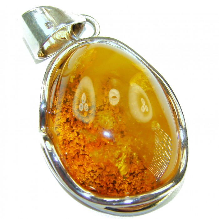 Prehistoric Authentic Baltic Amber .925 Sterling Silver beautifully handcrafted Pendant - Amber pendant close-up with sterling silver setting.