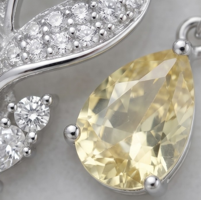 Luxurious 4.5 carat Golden - yellow Montana Sapphire .925 Sterling Silver handcrafted earrings - Close-up of luxurious golden-yellow Montana Sapphire with diamonds.