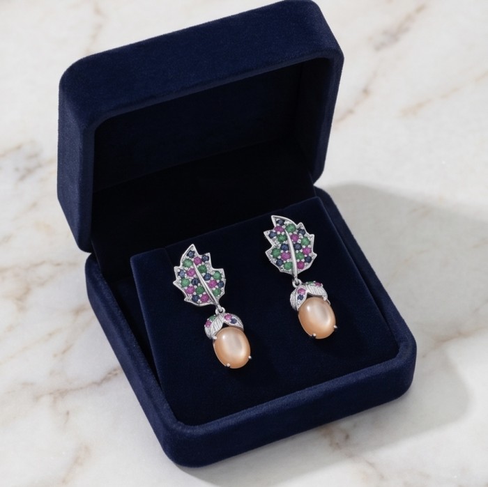Giovanna 18.2 carat Golden Sapphire .925 Sterling Silver dipped in rhodium Statement Earrings - Giovanna sapphire earrings in box, top view on marble background.