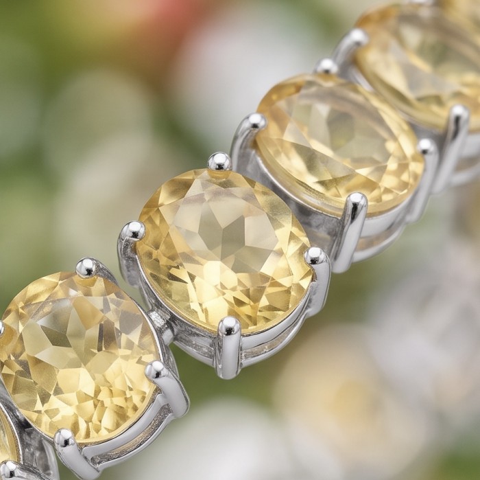 Enchanted Beauty oval cut 68.5 carat authentic Brazilian Citrine rhodium over .925 Sterling Silver handcrafted Bracelet - Close-up of oval cut Brazilian citrine stones in a silver bracelet.