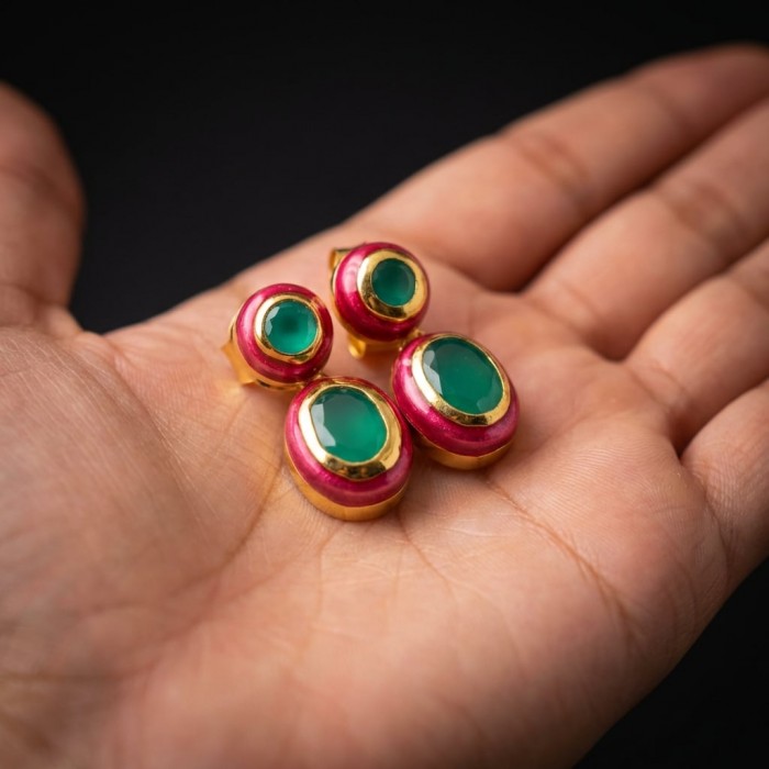 Countless Blessings Genuine 6.5 carat Authentic Emerald enamel 18K Gold over .925 Sterling Silver handcrafted earrings - Emerald earrings in hand, showcasing green stones and pink enamel details.