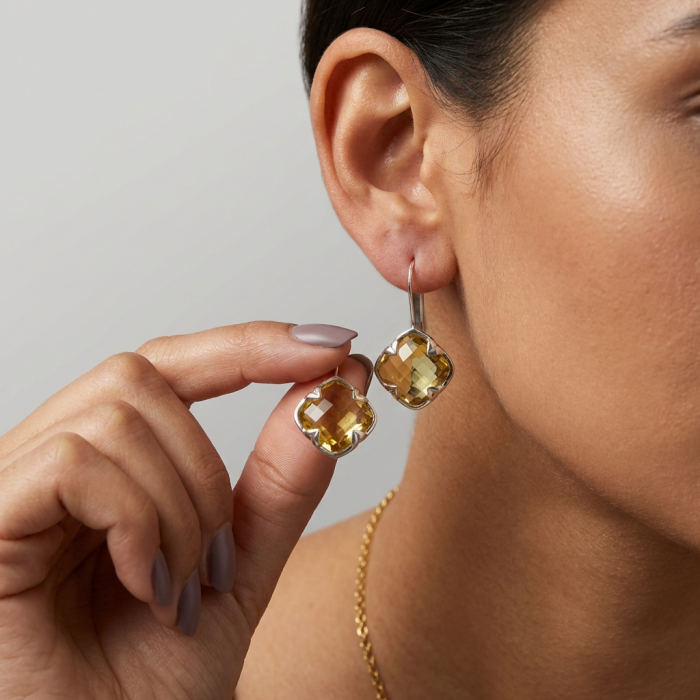 Summer Friday 25.8 carat Lemon Quartz .925 Sterling Silver handcrafted Statement Earrings - Close-up of lemon quartz earrings worn on ear and held in hand.