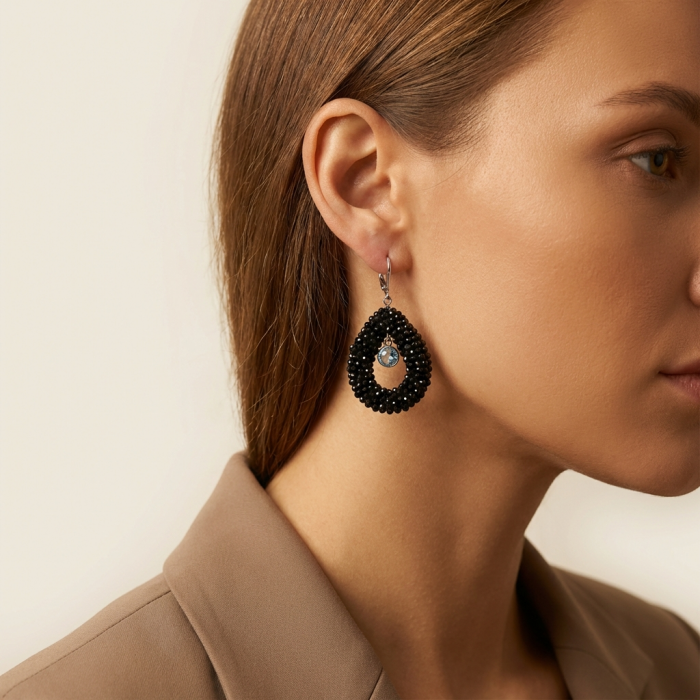 Spiritual Rebirth Precious genuine 29.7 CARAT Black Spinel .925 Sterling Silver STATAMENT earrings - Side view of person wearing Spiritual Rebirth 29.7 carat Black Spinel earring.