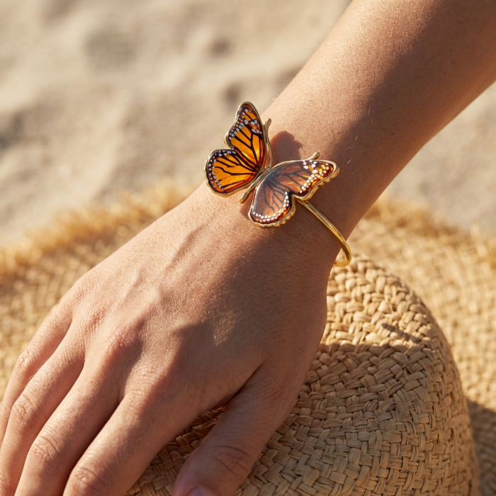 Golden Butterfly Genuine carved Baltic Amber .925 Sterling Silver dipped in 18K Gold handamde Bracelet - Golden butterfly bracelet worn on hand, close-up view.
