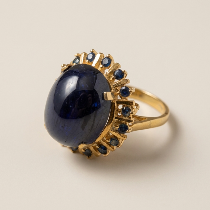 Authentic 14.5 carat Brazilain Kyanite 2.1 carat rare Grandidierite .925 Sterling Silver dipped in 22K Gold handcrafted Ring size 7 1/4 - Side view of a gold ring with a large blue stone and smaller accents.
