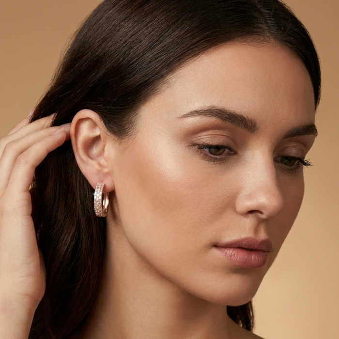 Allure Natural 12.2 carat White Topaz .925 Sterling Silver dipped in Rose Gold handcrafted hoop earrings - Side view of Allure Natural earrings worn on woman's ear.