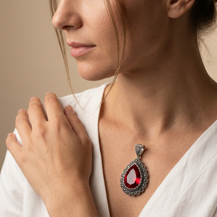 Crimson Fire Authentic 12.4 carat Garnet .925 Sterling Silver brilliantly handcrafted pendant - Garnet necklace worn close-up on neck, side view.