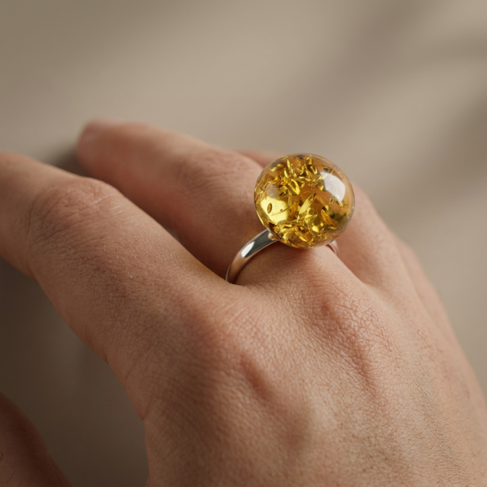 Golden Sphere Authentic Baltic Amber .925 Sterling Silver handcrafted ring; s. 8 - Golden Baltic amber ring on hand, showcasing silver band and amber sphere