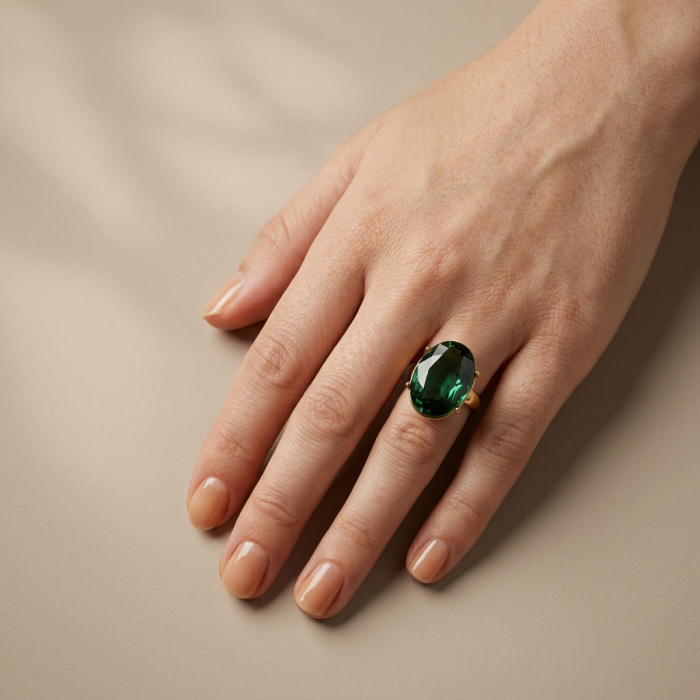 Exotic Beauty oval cut 17.5 carat Helenite .925 Sterling Silver dipped in Real Gold handmade Ring s. 9 adjustable - Oval cut Helenite ring worn on hand, showcasing its emerald green stone.